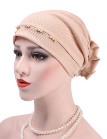 Fashion Beige Wearing A Flower Headband After Beading