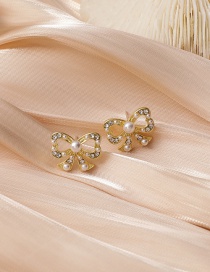 Fashion Golden Bowknot Diamond Pearl Alloy Hollow Earrings