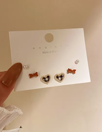 Fashion Coffee Color (three Pairs) Alloy Pearl Love Bow Earring Set